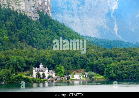 Beautiful summer Alpine lake Hallstatter See (Austria) view and castle far away. Stock Photo