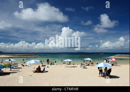 Beach goers relax in the sand on a hot summer's day jones beach long