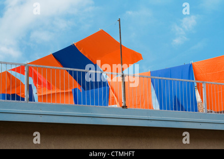 Brightly colored washing on a clothes line Stock Photo