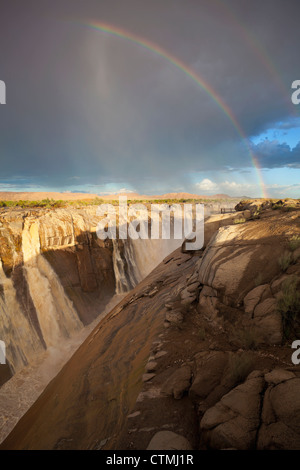 Rainbow over flooding Augrabies waterfall, Augrabies Falls National Park, Northern Cape Province, South Africa Stock Photo