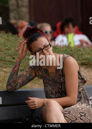 Young woman with lots of tattoos, UK Stock Photo