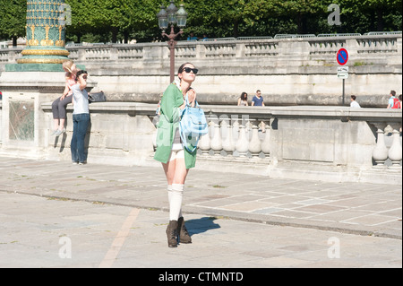 Paris, France - A young  woman fashionable chic posing in the streets Stock Photo