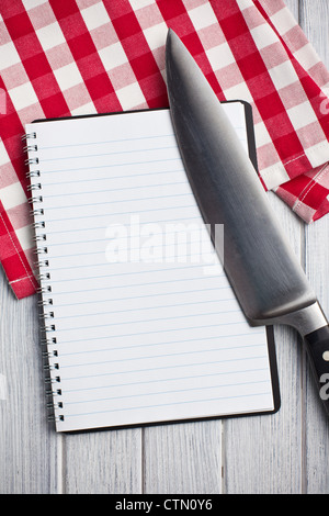 the blank recipe book with kitchen knife Stock Photo