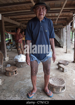 Tai Lu 'trouser' tattoos in Northern Laos. The Sak Yan (protection tattoos) tradition in Laos is much diminished. Stock Photo