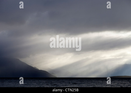 Breaking skies above Lake Te Anau, New Zealand Stock Photo