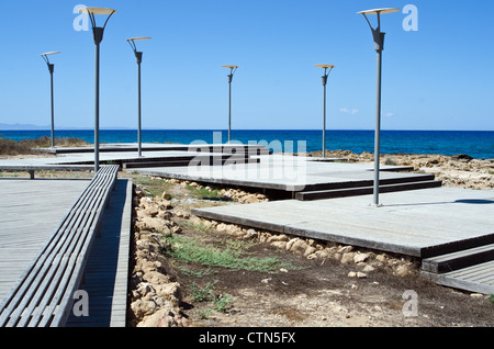 the road to the sea and lampposts in Cyprus Stock Photo