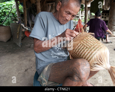 Tai Lu 'trouser' tattoos in Northern Laos. The Sak Yan (protection tattoos) tradition in Laos is much diminished. Stock Photo