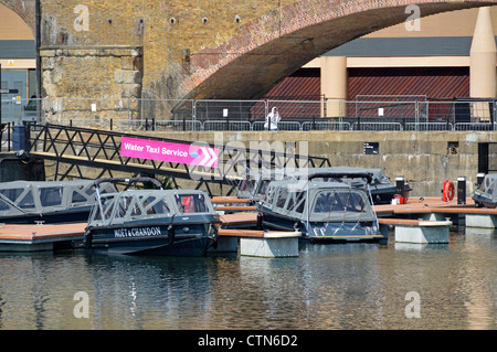 Water taxis moored close to Docklands Light Railway station providing waterbourne transport to London 2012 Olympics at Stratford Stock Photo