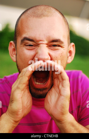 Closeup of a young man screaming Stock Photo