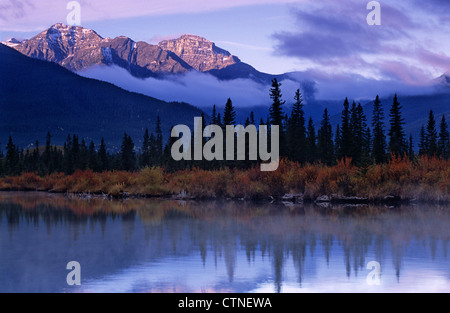Mist rises from the surface of the first Vermillion Lake during early morning, at Banff National Park, Canada