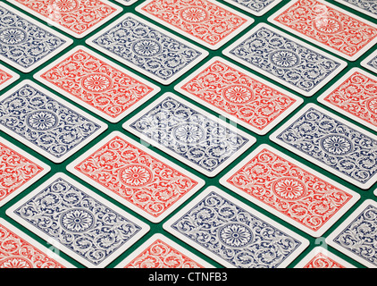 Playing cards on a green table. Stock Photo