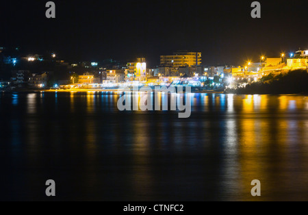 Summer coast night view with illuminated Himare Town (Albania) Stock Photo