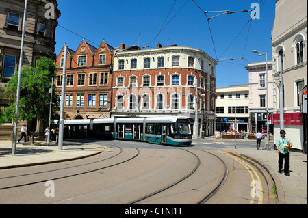 A Nottingham tram turns the corner on victoria street england uk Stock Photo