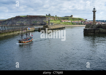 The Endeavour bark  a scaled replica of Cook's ship departing from the harbour at Whitby Stock Photo