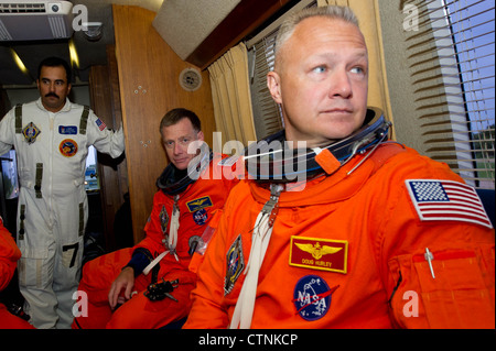STS-135 space shuttle Atlantis pilot, Douglas Hurley, right, and STS-135 commander Christopher Ferguson are seen in the Astrovan as they ride to launch pad 39A to board space shuttle Atlantis on Friday, July 8, 2011, at the Kennedy Space Center in Cape Canaveral, Florida. Stock Photo