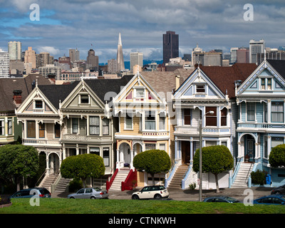 Victorian Houses and San Francisco Skyline from Alamo Square Stock Photo