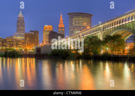 The skyline of Cleveland, Ohio at twilight as viewed over the Cuyahoga River from the Flats. Stock Photo