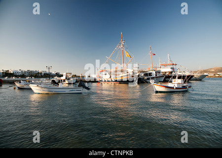 Sailboats and fishing boats in the traditional harbor of Antiparos, Greece. Stock Photo