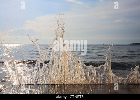 Sea water splash on breakwater Stock Photo