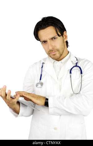 Cool handsome doctor looking while working with tablet ipad Stock Photo
