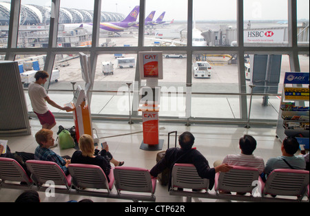 Departure gate and waiting area at the Suvarnabhumi Airport or the New Bangkok International Airport in Bangkok, Thailand. Stock Photo