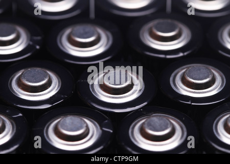 close up the top of AA battery,color on green Stock Photo