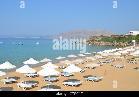 The popular sandy beach at Pefkos on the Greek Island of Rhodes. Stock Photo