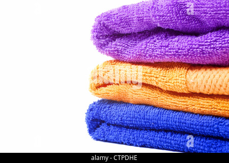 Three multi-colored towels on white background Stock Photo
