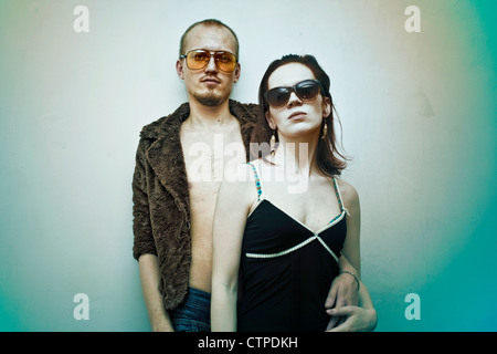 Young man and woman in sunglasses on white background Stock Photo