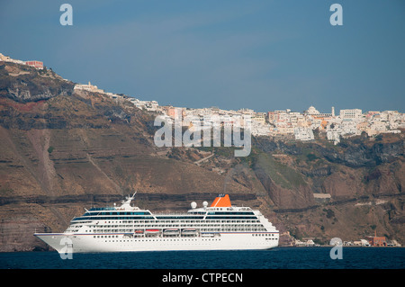 Cruise ships below Fira the Capital town on the island of Santorini in the Cyclades islands in Greece Stock Photo