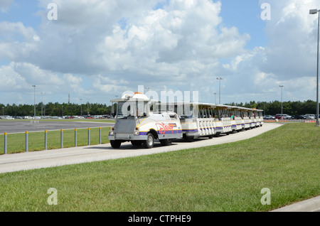 Disney Tram servicing the car park areas at Disney Florida. The tram collects and returns customer to and from the parking areas Stock Photo