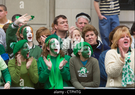 Crowd members cheer during the New York City St. Patrick's Day parade on Mar. 16, 2002. Stock Photo