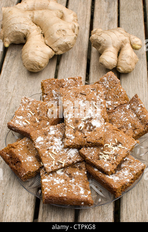 homemade ginger cookies over wooden table with fresh ginger root Stock Photo