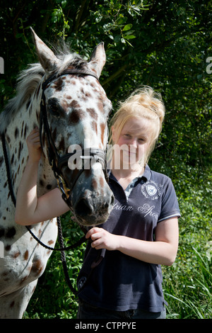 Teenage girl with appaloosa horse, Stanwell Moor, Surrey, England, United Kingdom Stock Photo