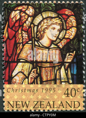 A stamp printed in New Zealand, is dedicated to Christmas, Stained glass windows, depicts Archangel Gabriel, circa 1995 Stock Photo