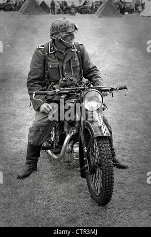 B/W image of a Waffen-SS Dispatch Rider and his motorcycle Stock Photo