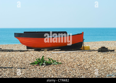 Small fishing boat on shingle beach at Shoreham. West Sussex. England Stock Photo