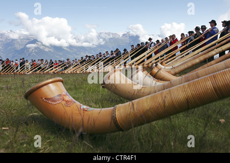 Alphorn players take part in the morceaux d’ensemble, in Cor des Alpes festival of Nendaz, Valais, Switzerland Stock Photo