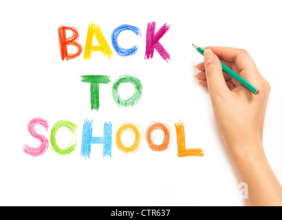 Hand writing with a pencil - back to school. On a white background Stock Photo