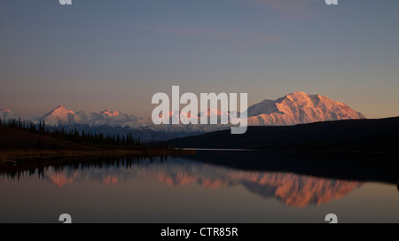 Sunset view of Mt. McKinley and Mt. Deception reflecting in Wonder Lake, Interior Alaska, Autumn Stock Photo