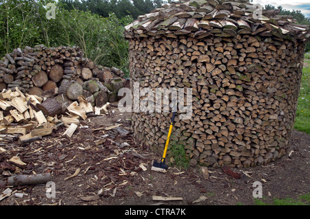 Circular Log stacks North Norfolk UK July Stock Photo