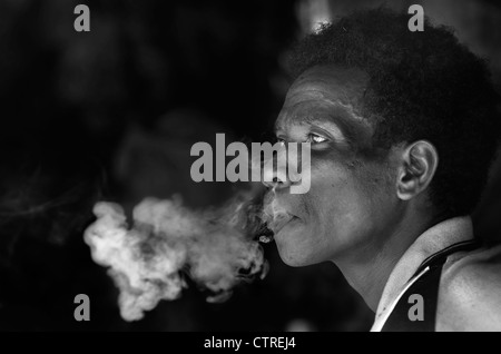 aborigines of malaysia smoking, taman negara, pahang Stock Photo