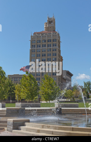 Downtown Asheville, North Carolina with an old art deco building and fountain in Pack Square in the foreground Stock Photo