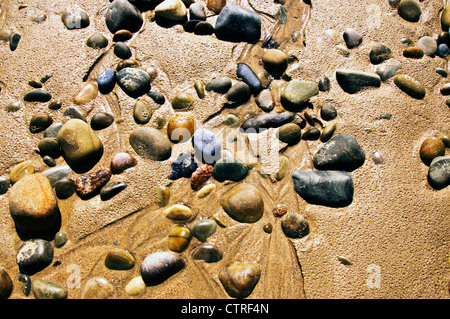Coloured pebbles on a beach Stock Photo