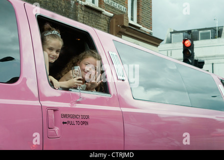 Stretched pink limo preteen children kids girls birthday party London 2012, 2010s UK England HOMER SYKES Stock Photo