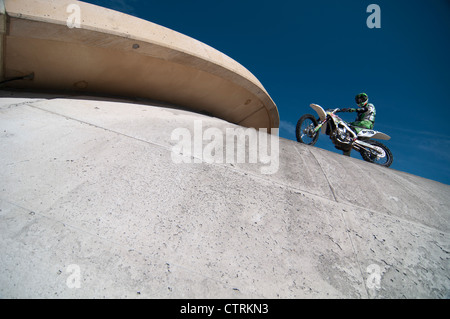 Motorbike driver stands on a tunnel Stock Photo