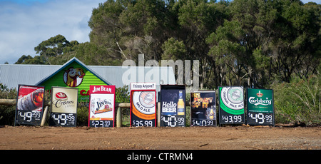 Signs advertising beer for sale on a roadside in Western Australia Stock Photo