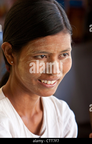 Myanmar, Burma. Burmese Woman Wearing Thanaka Paste as a Cosmetic Sunscreen. Stock Photo