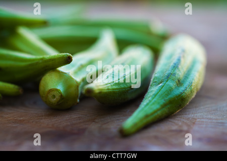 Okra on a chopping board Stock Photo