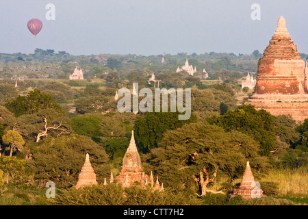 Myanmar, Burma, Bagan. Hot-air Balloons offer Tourists an Aerial View of the Temples. Stock Photo